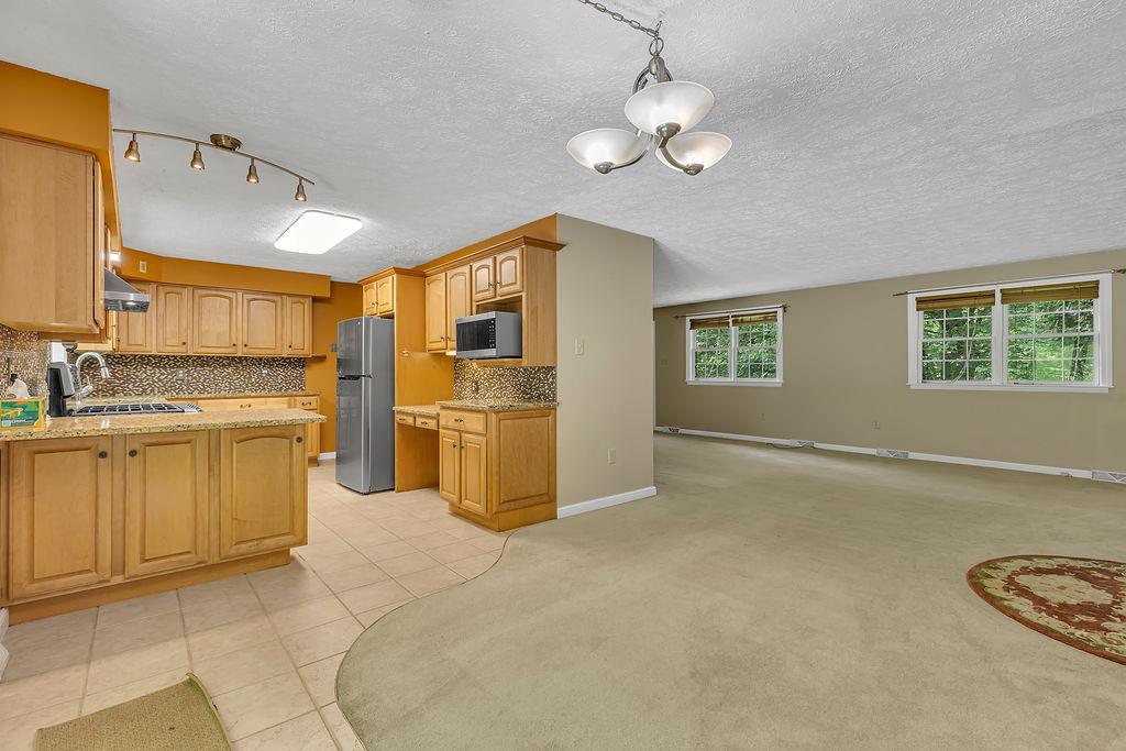171 Dehaven Road Beaver Falls, PA 15010 - Photo 9 of 35 a large white kitchen with cabinets