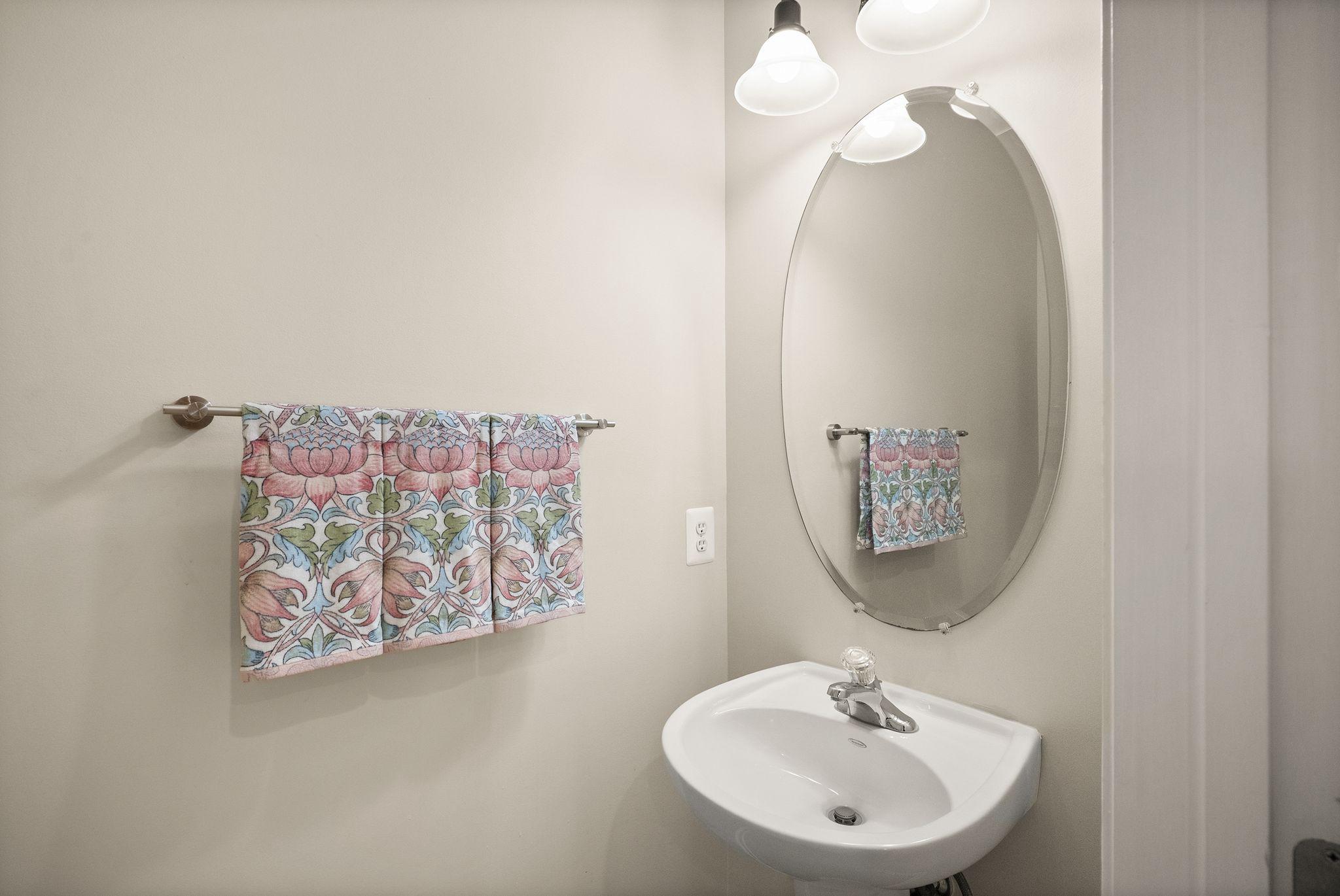 12414 A Liberty Bridge Road Fairfax, VA 22033 - Photo 14 of 38 a bathroom with a sink mirror and vanity