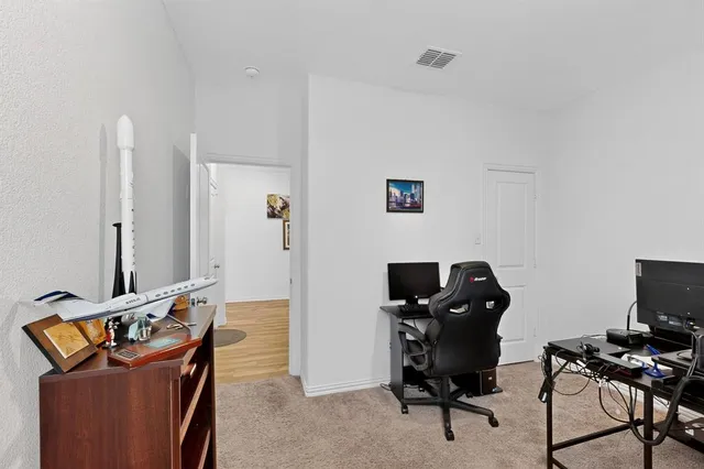 a view of a workspace with furniture