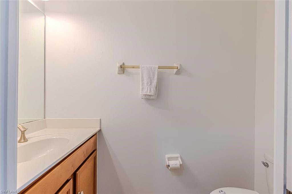 15326 Summit Pl Circle Naples, FL 34119 - Photo 13 of 21 a bathroom with a sink and vanity