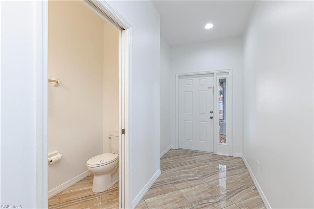15326 Summit Pl Circle Naples, FL 34119 - Photo 14 of 21 a bathroom with a toilet and a shower
