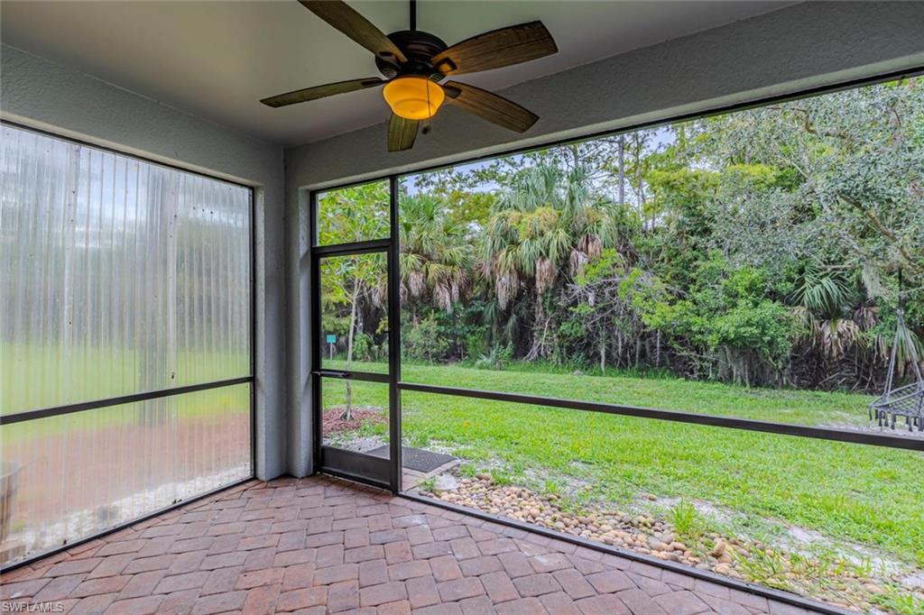 15326 Summit Pl Circle Naples, FL 34119 - Photo 17 of 21 a view of a room with a big yard