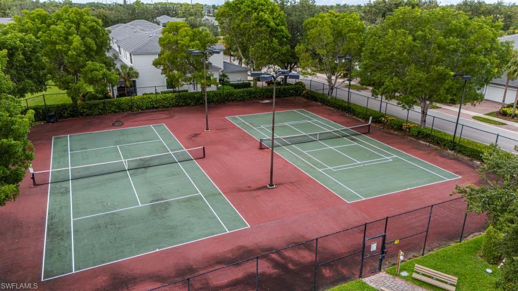 15326 Summit Pl Circle Naples, FL 34119 - Photo 18 of 21 a tennis court that has tennis net