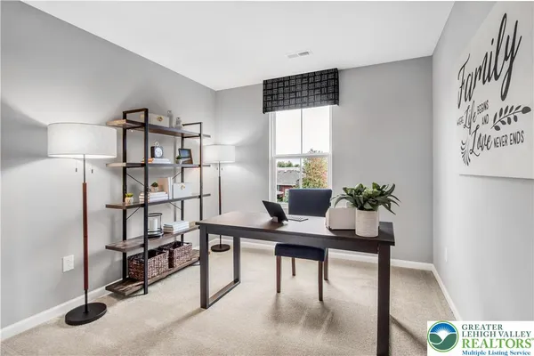 a view of a workspace with furniture