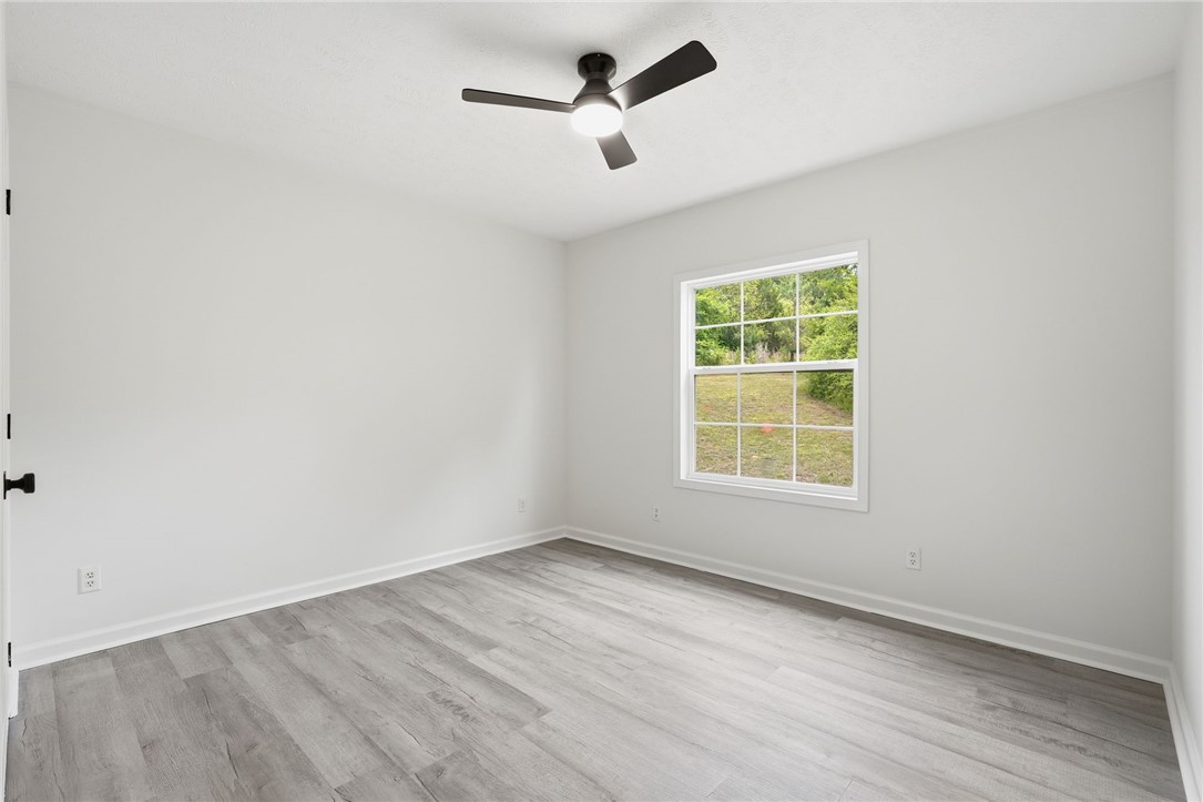 112 Sir Francis Drake Way Liberty, SC 29657 - Photo 21 of 42 Bright and airy room with serene views of nature, offering a peaceful retreat.