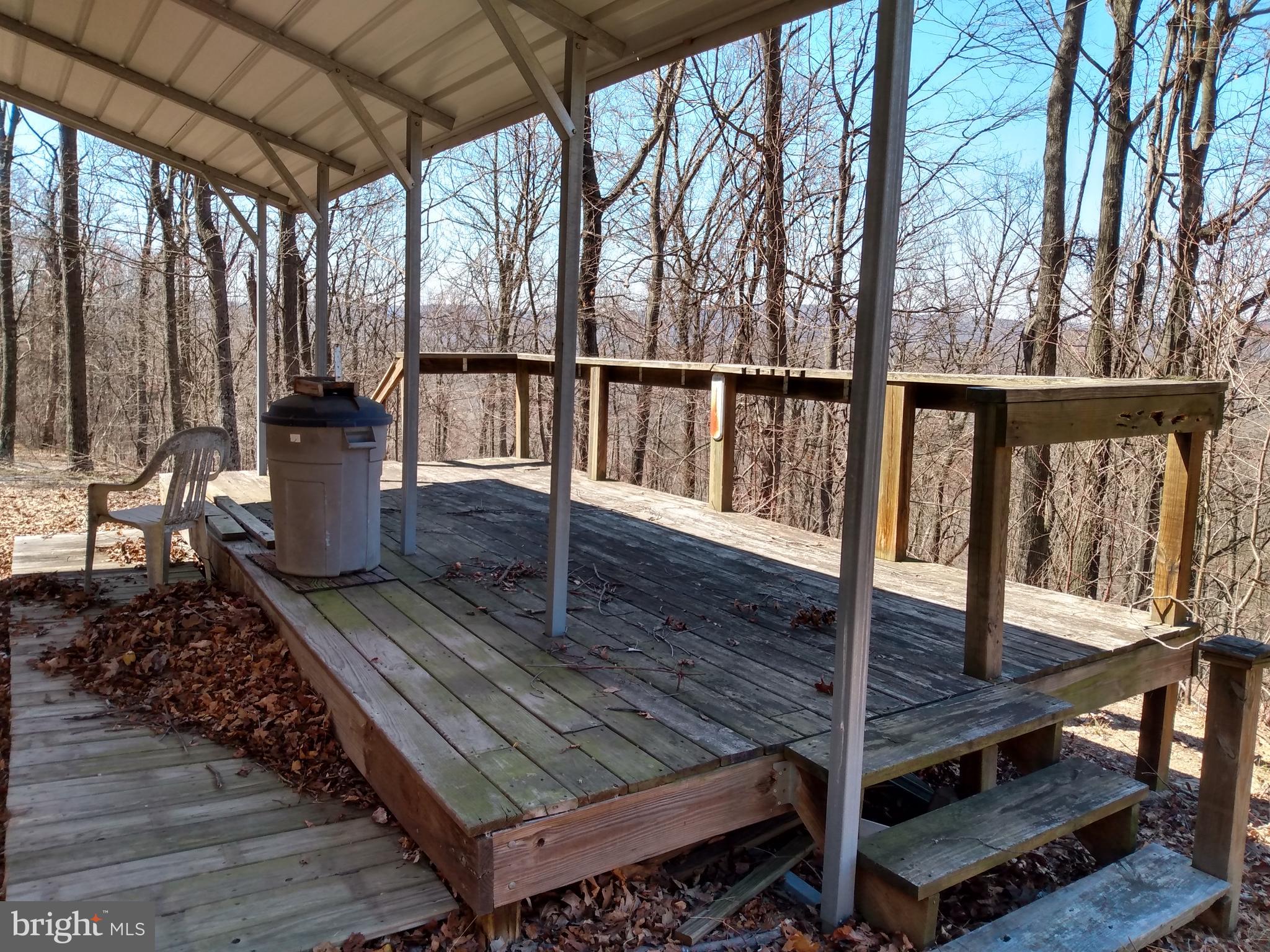 4 Kessel Road Great Cacapon, WV 25422 - Photo 9 of 15 a view of a balcony with wooden floor
