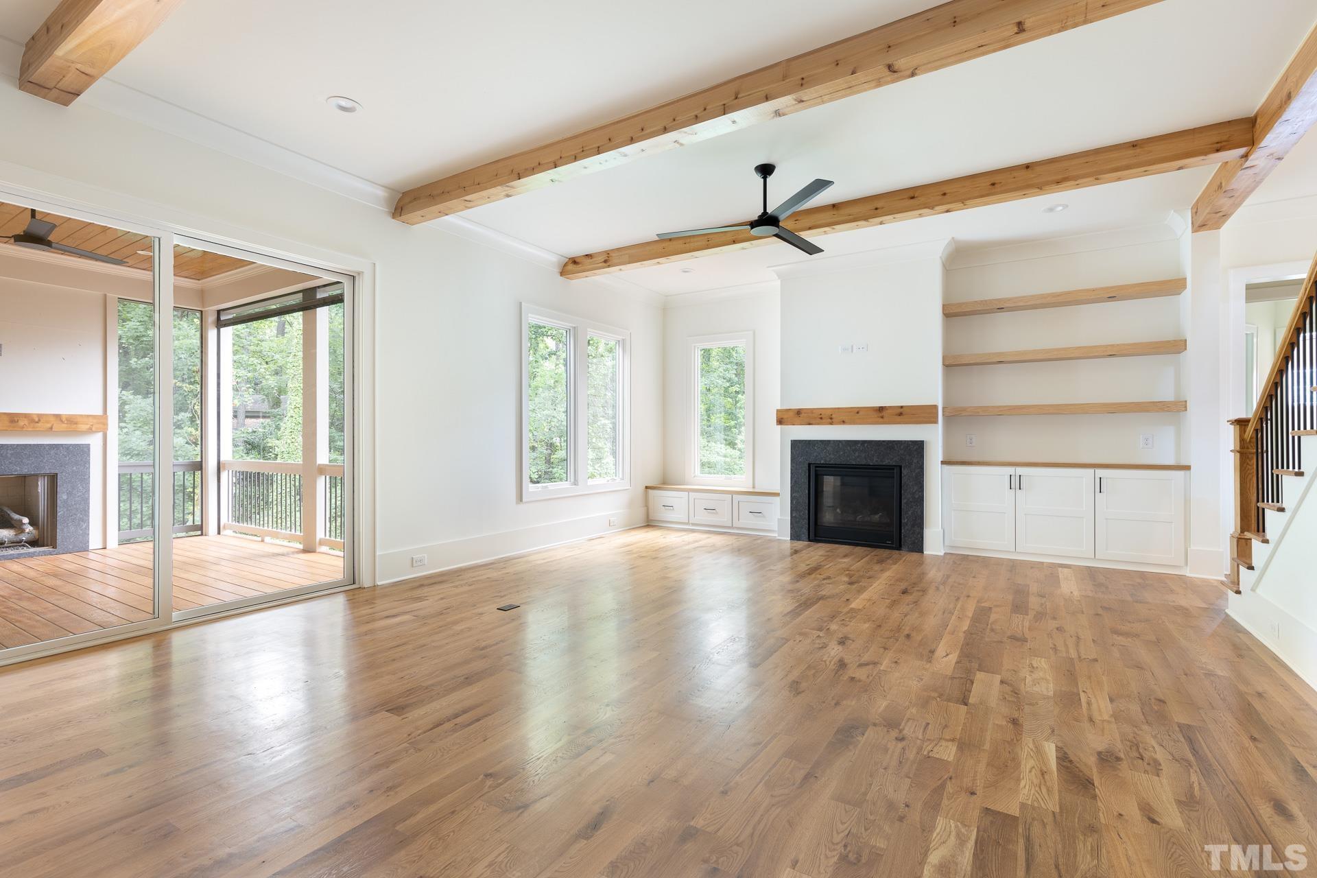 6316 Stephens Rdg Court Raleigh, NC 27615 - Photo 23 of 53 a view of empty room with wooden floor and fireplace
