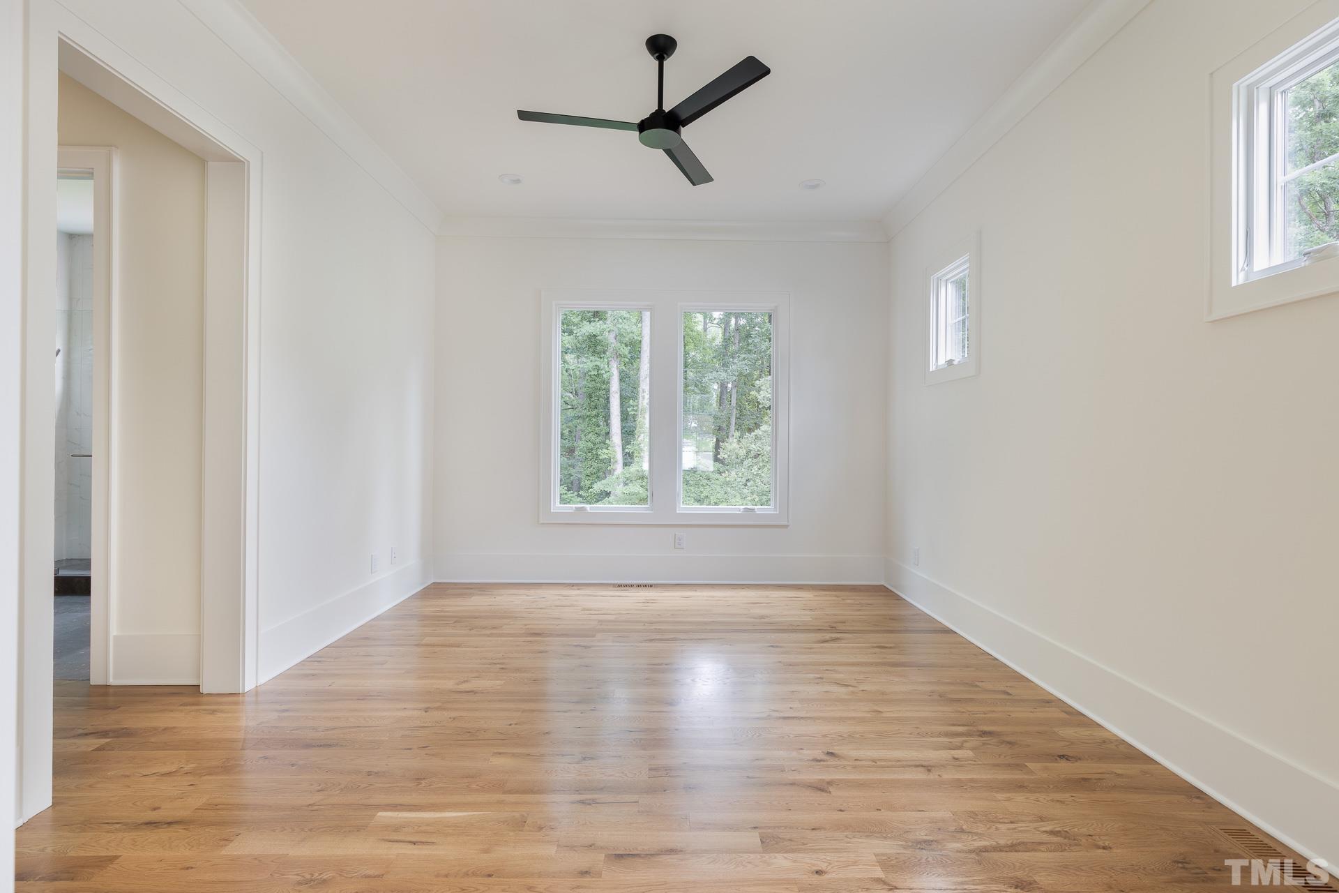 6316 Stephens Rdg Court Raleigh, NC 27615 - Photo 25 of 53 wooden floor in an empty room with a window