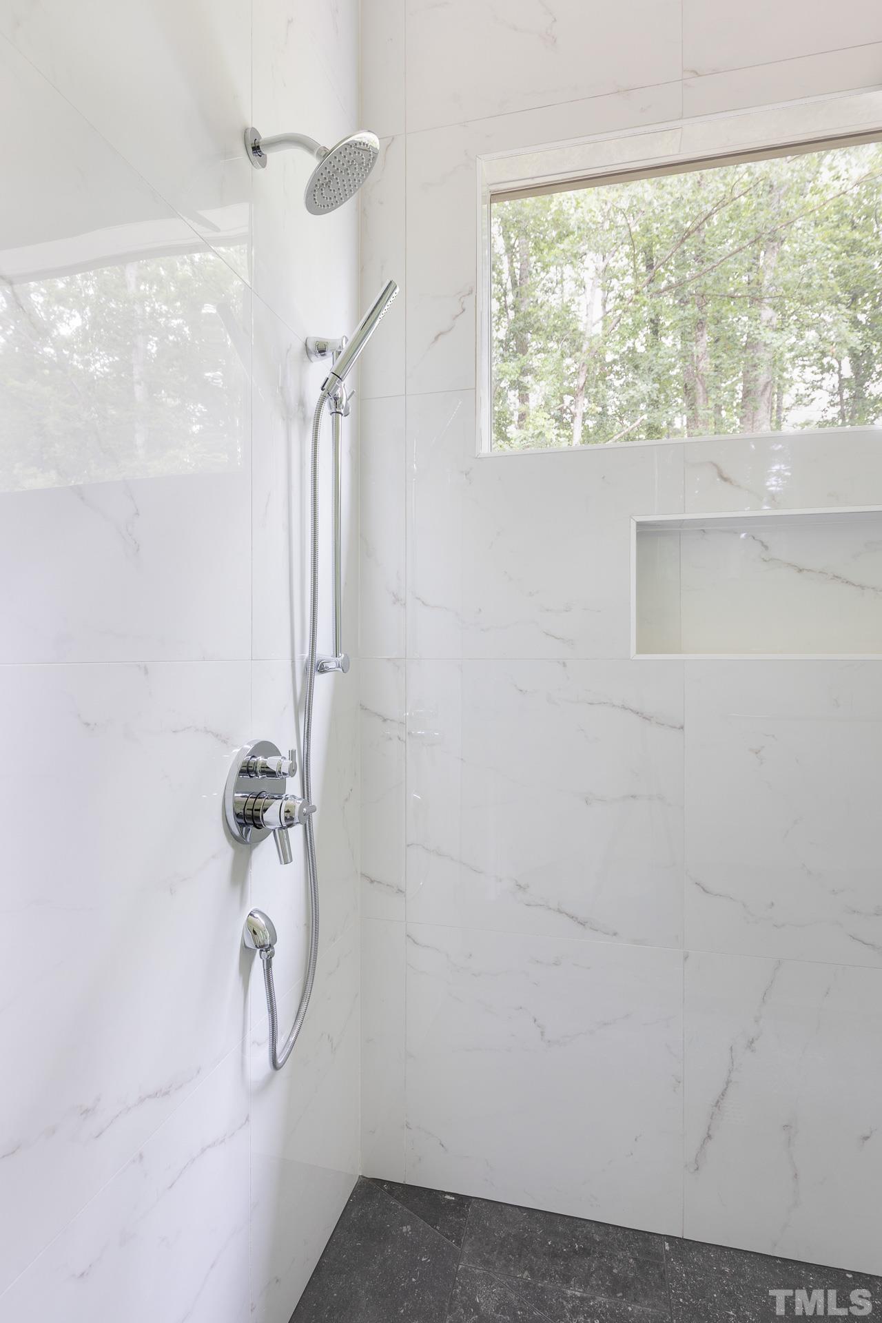 6316 Stephens Rdg Court Raleigh, NC 27615 - Photo 29 of 53 a bathroom with a window and a shower