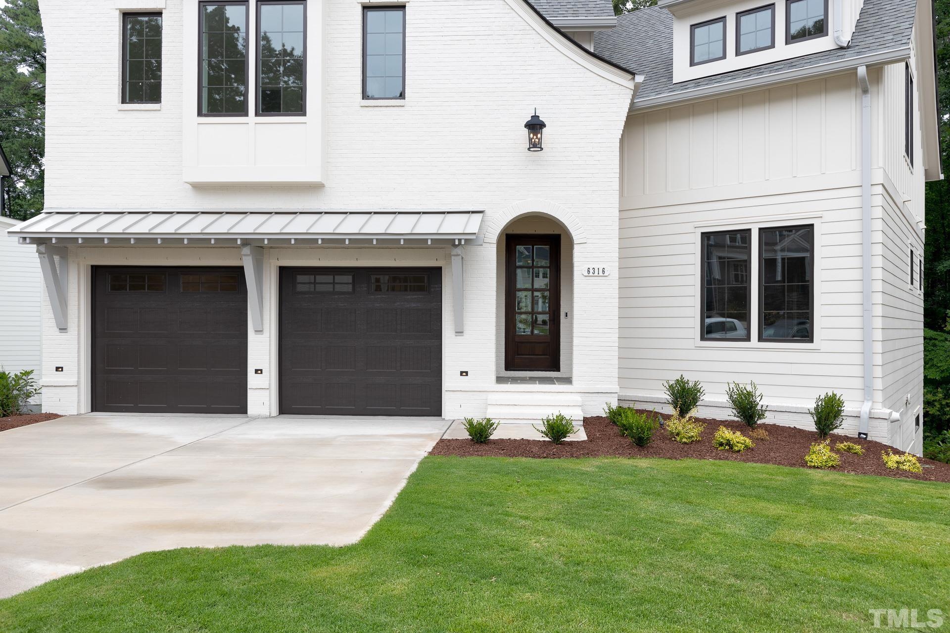 6316 Stephens Rdg Court Raleigh, NC 27615 - Photo 3 of 53 a front view of a house with garden