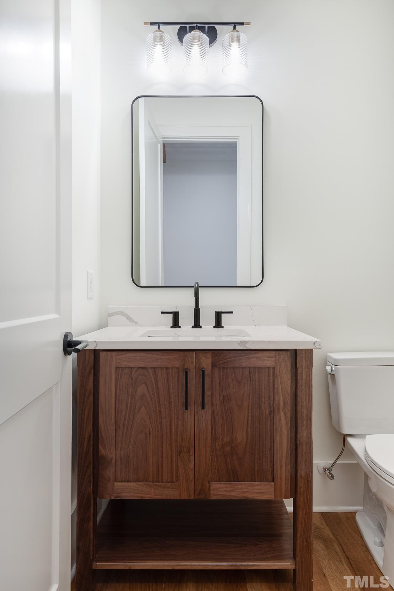 6316 Stephens Rdg Court Raleigh, NC 27615 - Photo 32 of 53 a bathroom with a sink and a mirror