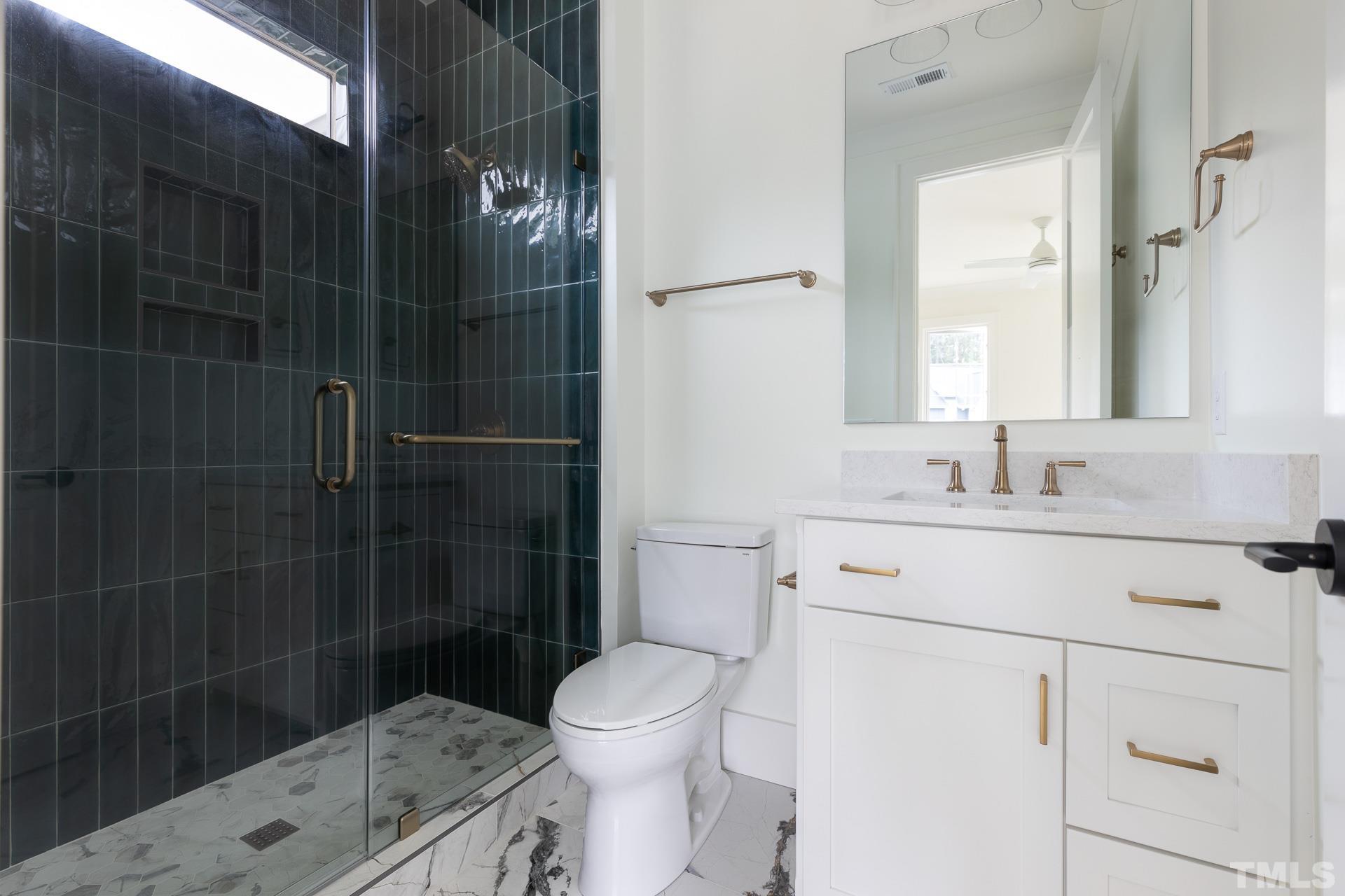 6316 Stephens Rdg Court Raleigh, NC 27615 - Photo 40 of 53 a bathroom with a sink a toilet and shower