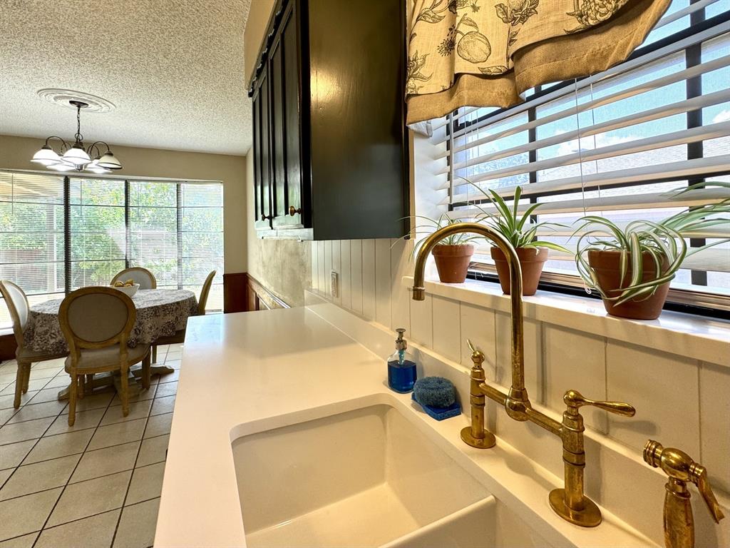 113 Northeast Timber Ridge Drive Burleson, TX 76028 - Photo 15 of 36 Fabulous BRASS Kitchen Faucet along with White Quartz Countertops... Stunning!!
