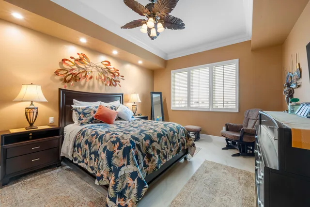 a bedroom with a bed and lamp