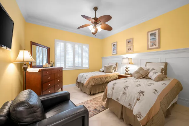 a bedroom with a bed and a lamp