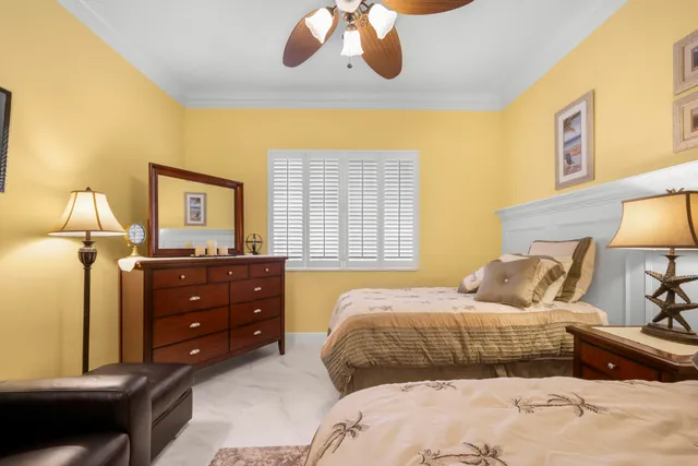 a bathroom with a granite countertop sink mirror vanity and toilet