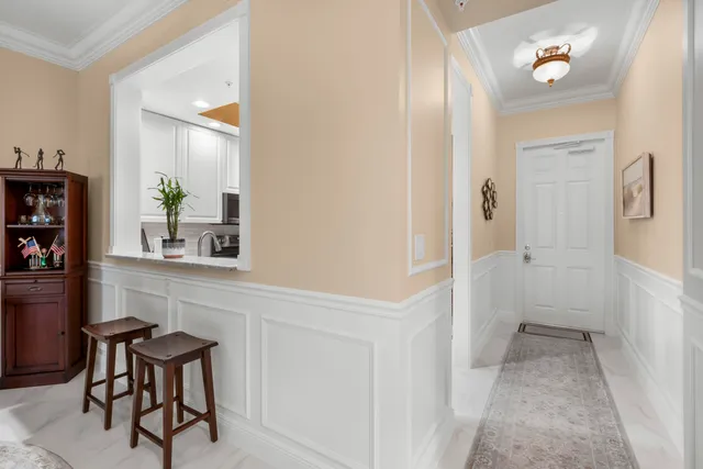 a view of a livingroom with furniture and a chandelier