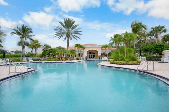 a view of a swimming pool and a chair