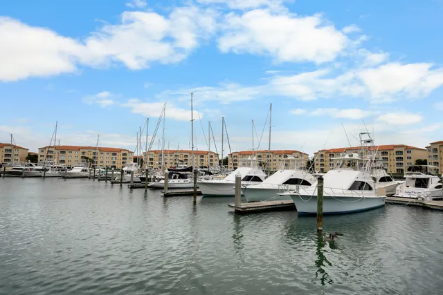 a view of water with boats and trees