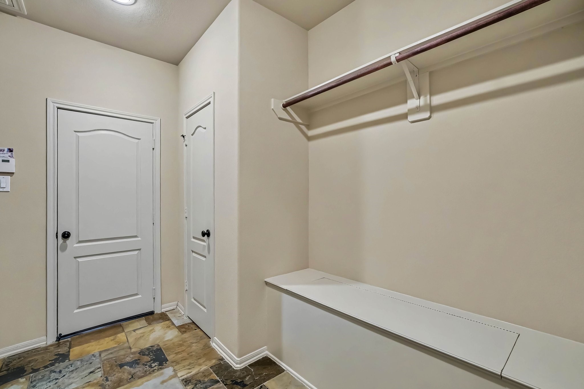 62 Sandwell Place Spring, TX 77389 - Photo 41 of 50 Spacious mud-room as you enter from the garage featuring ample storage, and a convenient bench with a hanging rod for organization.
