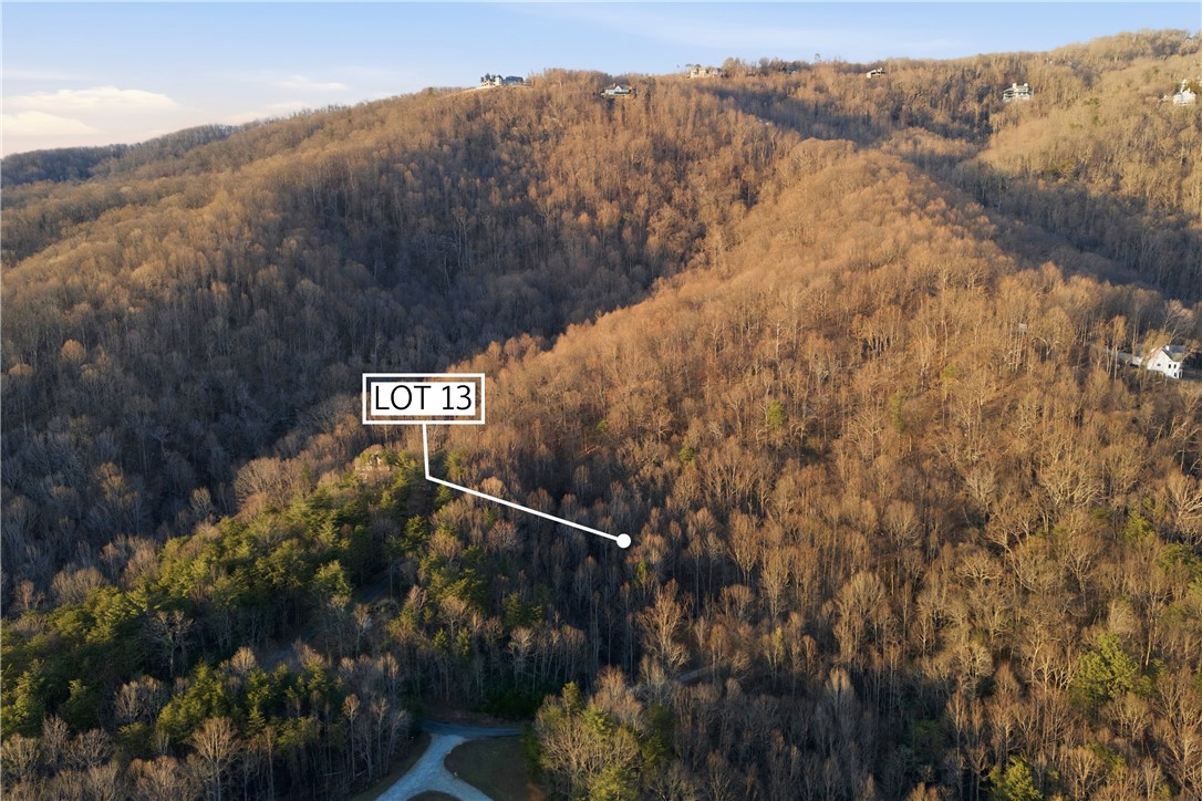 Lot 13 Hideaway Hill Way Landrum, SC 29356 - Photo 8 of 17 This expansive lot offers a tranquil retreat amidst nature's embrace, perfect for a custom home.