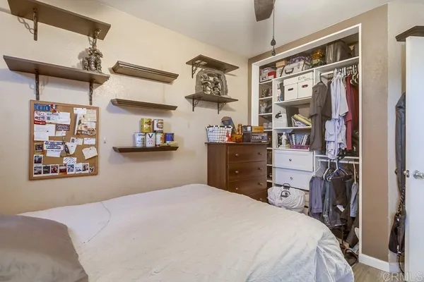 a bedroom with a bed and a walk in closet