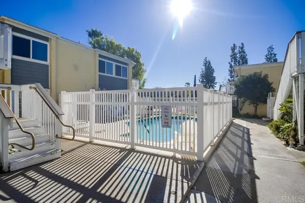 a view of a house with wooden deck