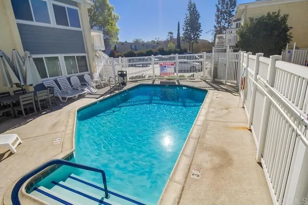 a view of a swimming pool with a lounge chairs