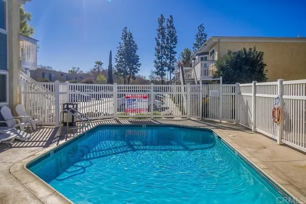 a view of swimming pool with outdoor seating
