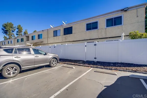 a front view of a building with parking space