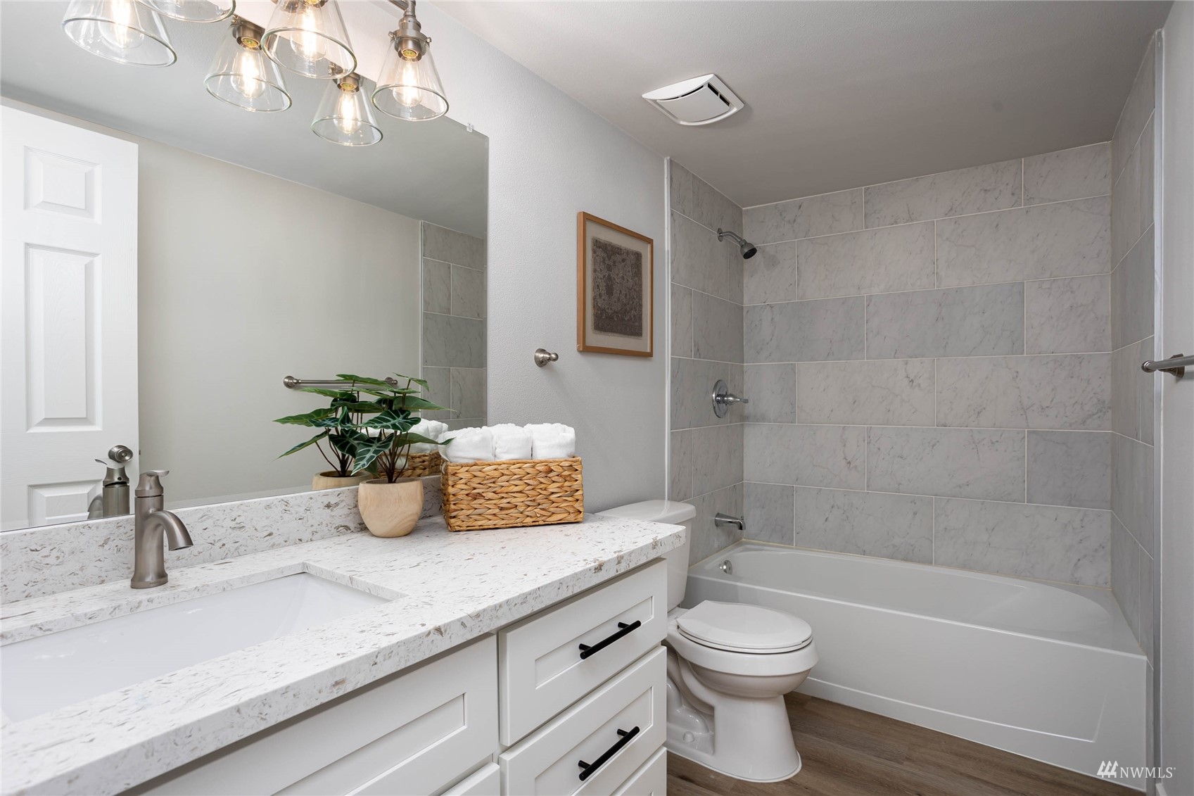 12419 Southeast 95th Way Renton, WA 98056 - Photo 16 of 30 a bathroom with a granite countertop sink a toilet and shower