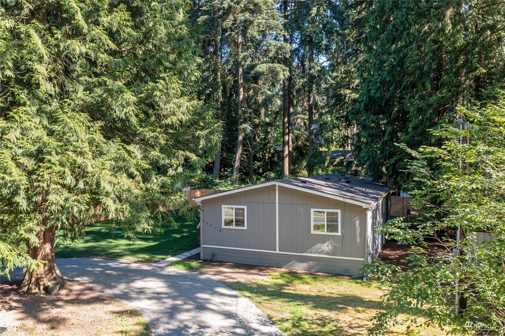 12419 Southeast 95th Way Renton, WA 98056 - Photo 25 of 30 a view of a house with a large tree and a yard