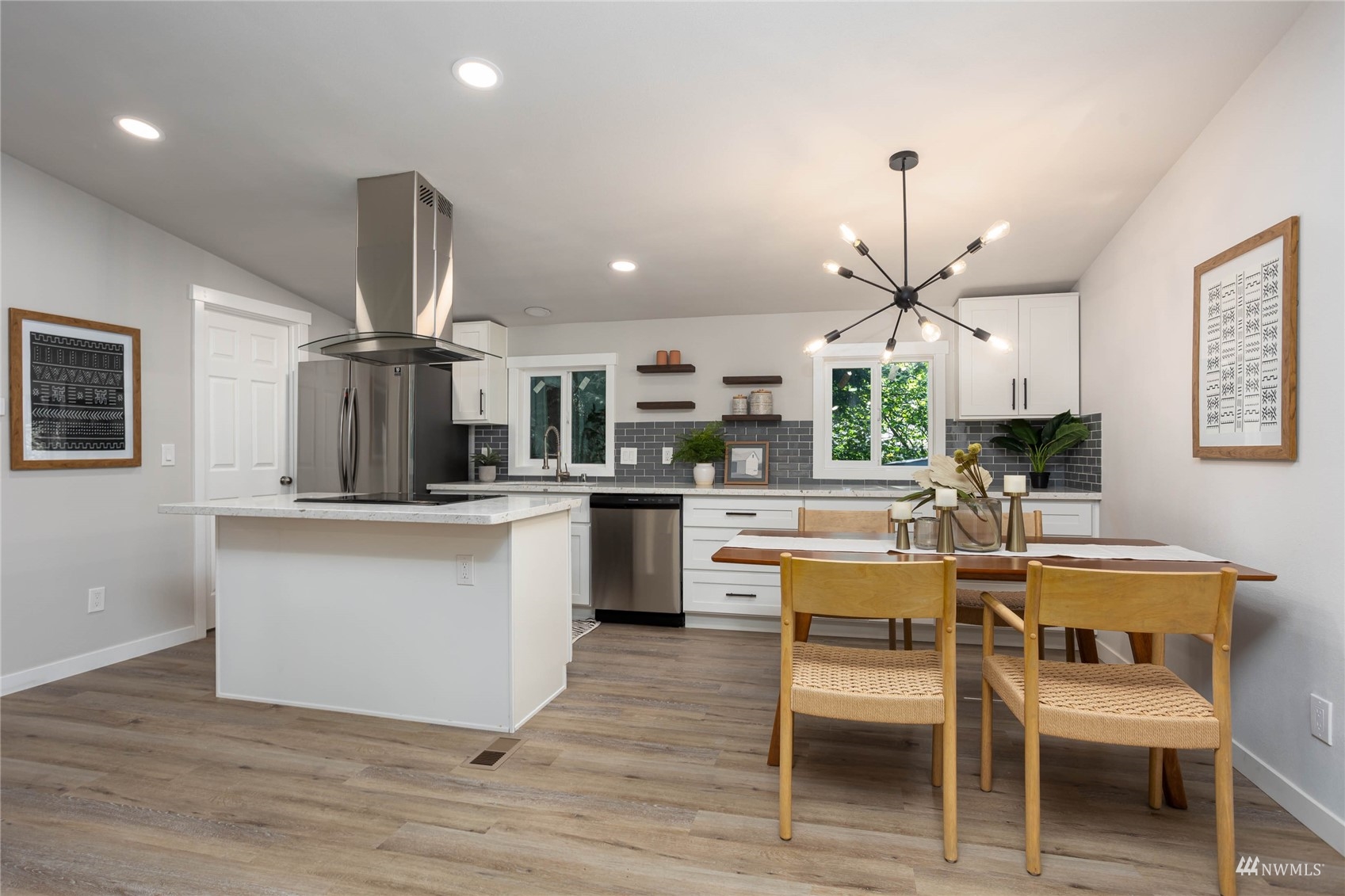 12419 Southeast 95th Way Renton, WA 98056 - Photo 5 of 30 a kitchen with stainless steel appliances kitchen island hardwood floor and wooden floor