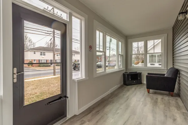 a living room with furniture and windows