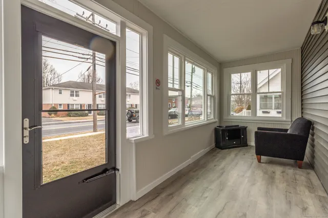 a living room with furniture and windows