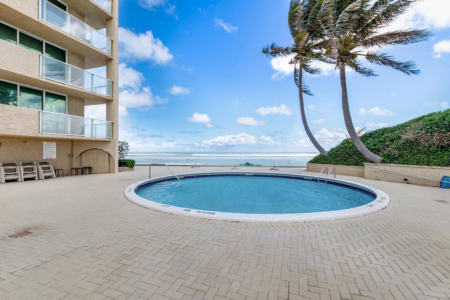 5440 North Ocean Drive, Unit 1502 Singer Island, FL 33404 - Photo 12 of 34 a view of outdoor space swimming pool and outdoor space