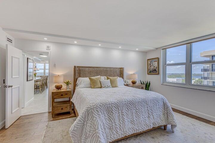 5440 North Ocean Drive, Unit 1502 Singer Island, FL 33404 - Photo 20 of 34 a bedroom with a large bed and a window