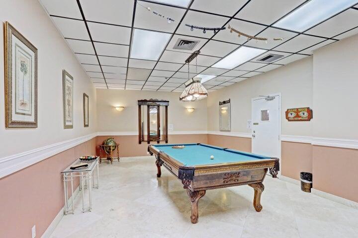 5440 North Ocean Drive, Unit 1502 Singer Island, FL 33404 - Photo 23 of 34 a room with pool table and windows