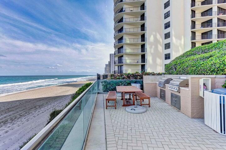 5440 North Ocean Drive, Unit 1502 Singer Island, FL 33404 - Photo 27 of 34 a terrace with outdoor seating and city view