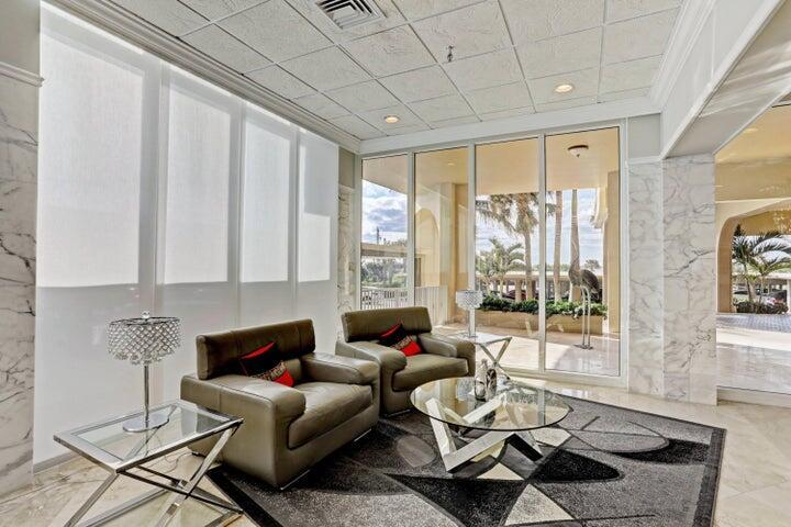 5440 North Ocean Drive, Unit 1502 Singer Island, FL 33404 - Photo 33 of 34 a living room with furniture and a large window