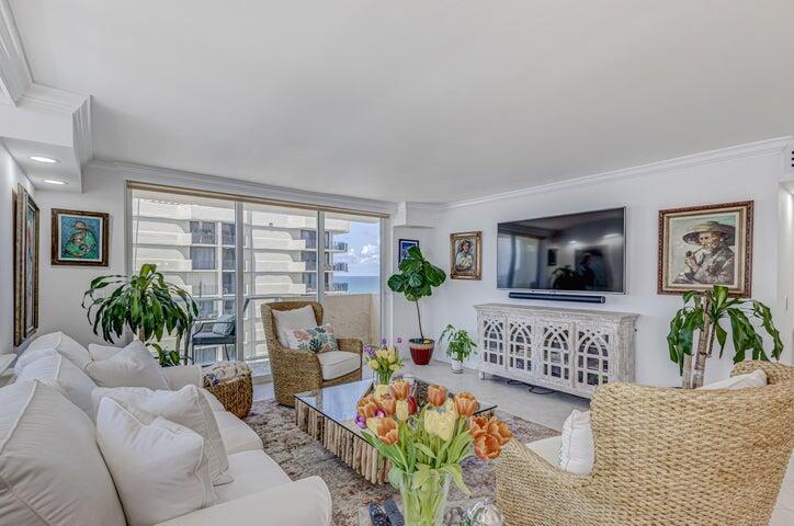 5440 North Ocean Drive, Unit 1502 Singer Island, FL 33404 - Photo 10 of 34 a living room with furniture and a large window