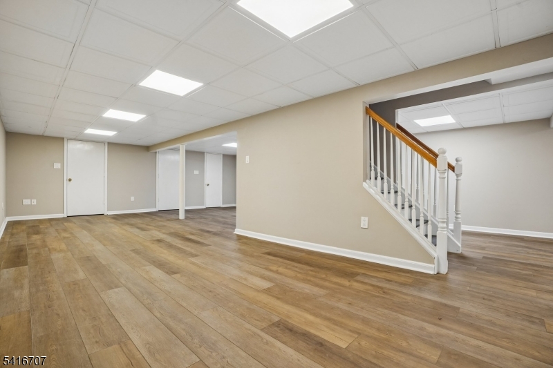 18 Juniper Way Bernards, NJ 07920 - Photo 27 of 31 a view of an empty room with wooden floor