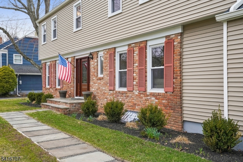 18 Juniper Way Bernards, NJ 07920 - Photo 3 of 31 a front view of a house with a yard