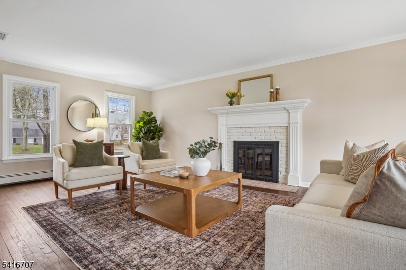 18 Juniper Way Bernards, NJ 07920 - Photo 7 of 31 a living room with furniture and a fireplace