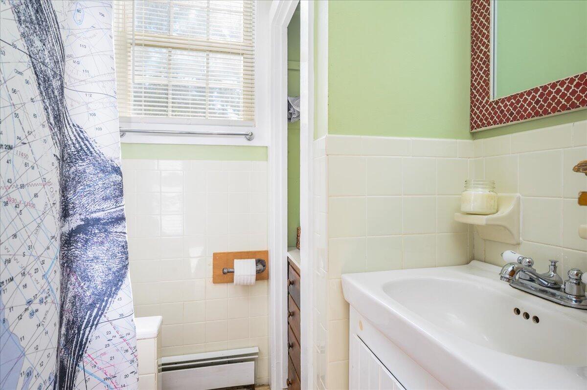 25 Cranberry Hollow Road Wellfleet, MA 02667 - Photo 12 of 18 a bathroom with a sink a toilet and shower