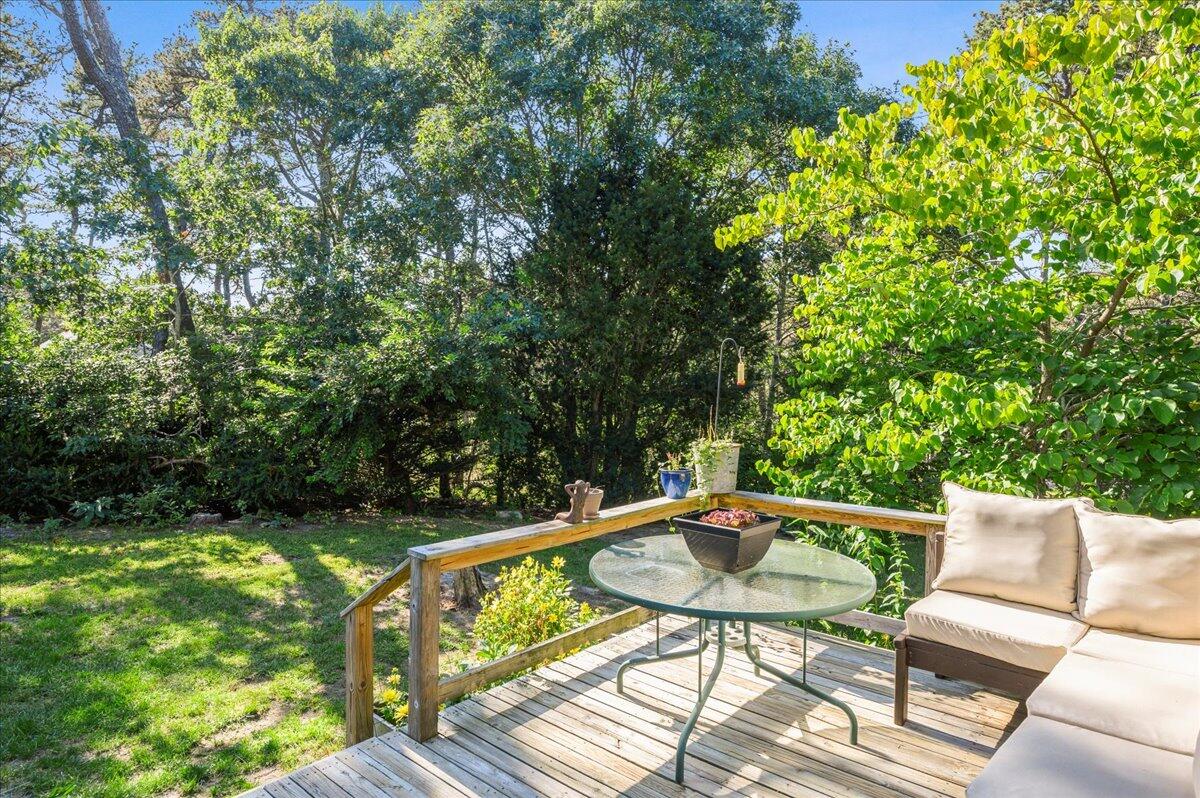 25 Cranberry Hollow Road Wellfleet, MA 02667 - Photo 13 of 18 a view of sitting area with furniture and wooden deck