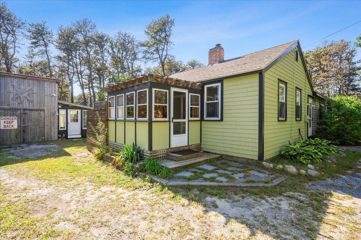 25 Cranberry Hollow Road Wellfleet, MA 02667 - Photo 17 of 18 a view of a house with a yard