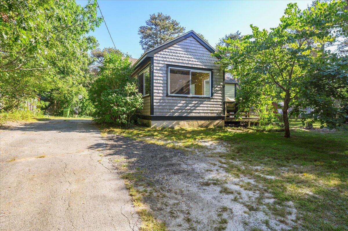 25 Cranberry Hollow Road Wellfleet, MA 02667 - Photo 18 of 18 a view of a house with a yard