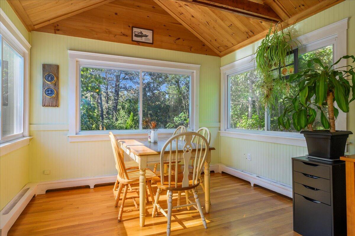 25 Cranberry Hollow Road Wellfleet, MA 02667 - Photo 3 of 18 a view of a dining room with furniture window and wooden floor