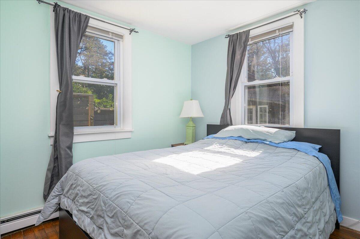 25 Cranberry Hollow Road Wellfleet, MA 02667 - Photo 9 of 18 a bedroom with a bed and a window